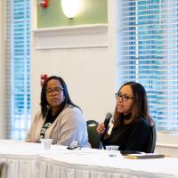 Four panelist engaging with audience